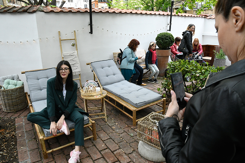 Guests taking photos at the garden event in Bulgaria