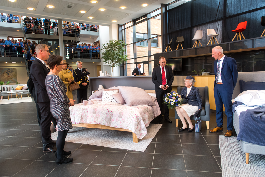 Queen sits in the reception