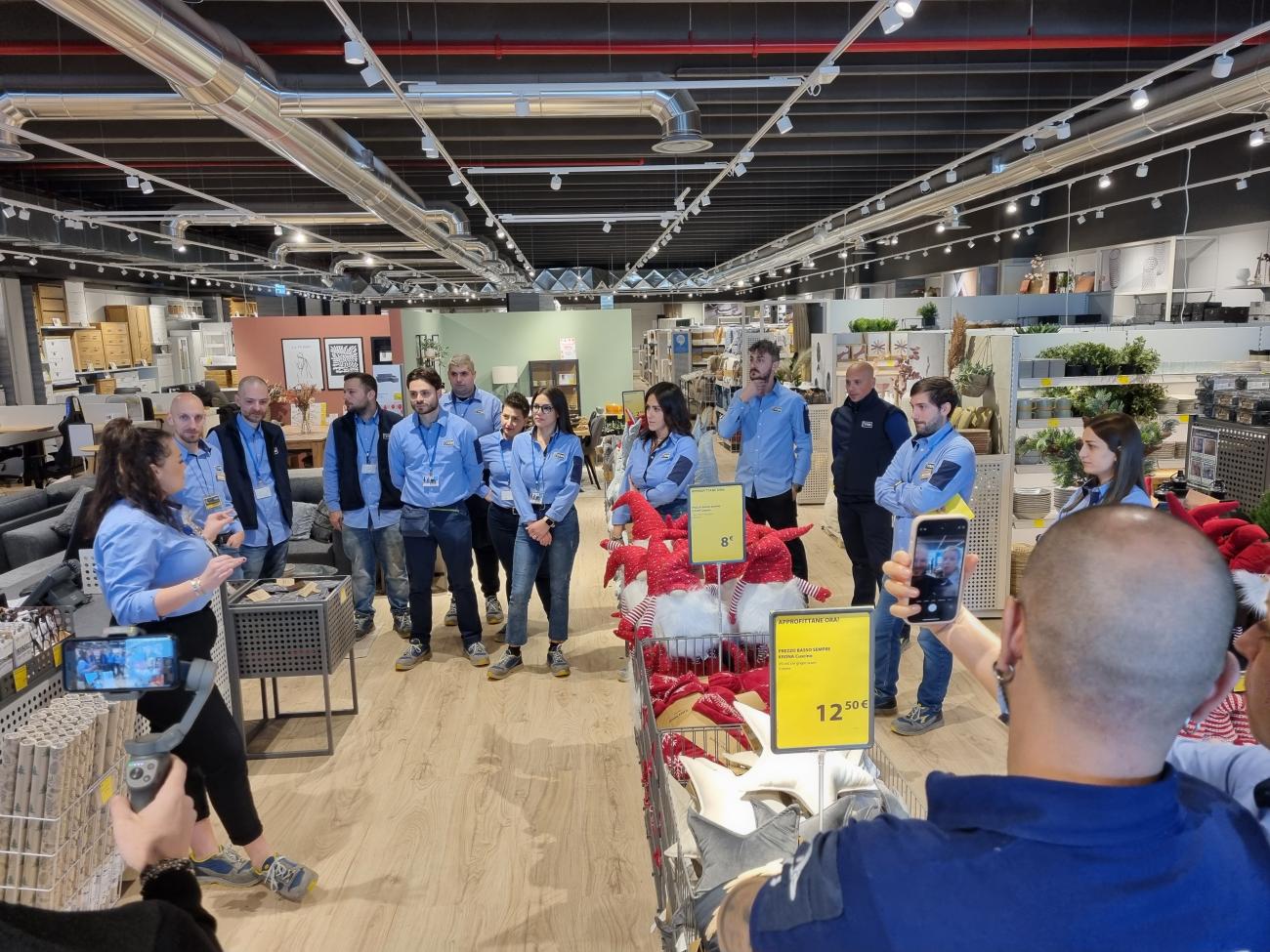 Store Manager Vittoria gives the team a final motivational speech. 