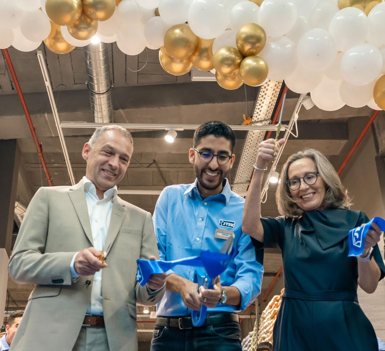 Badr Naciri, Store Manager in JYSK Aeria Mall, cuts the ribbon.