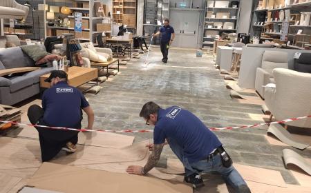 The three Romanian E-Team Members (Alex, Cosmin and Daniel) preparing a store.